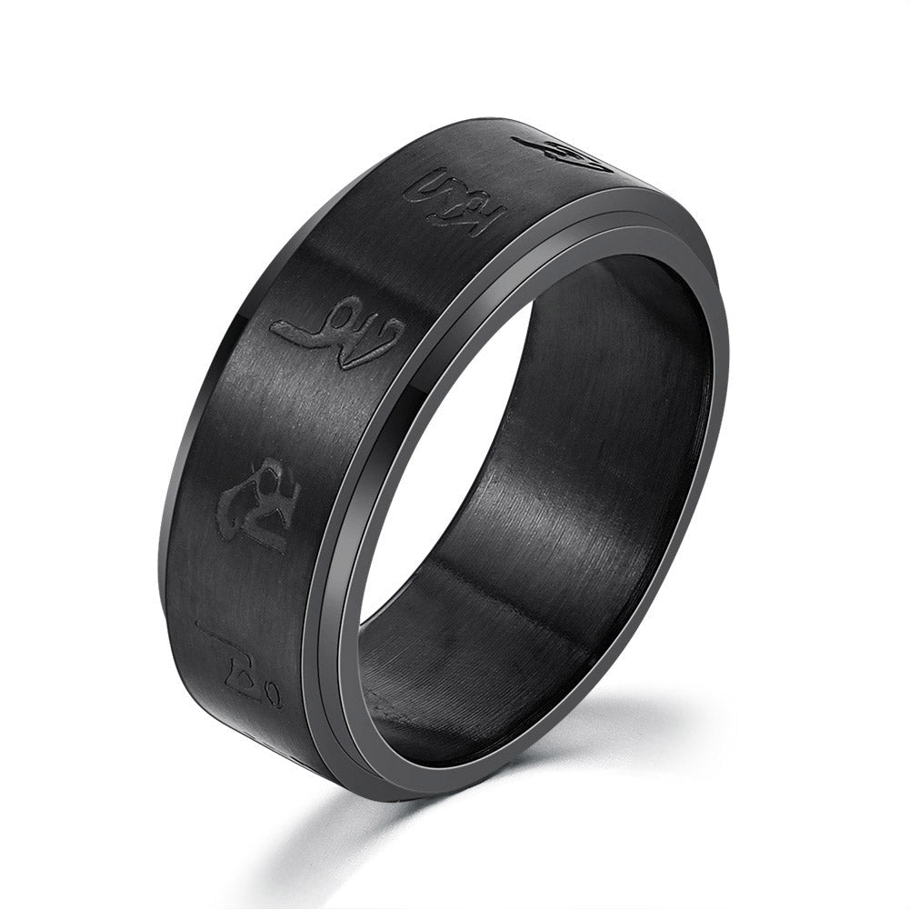 Detail close-up of a textured black ring with smooth edges.