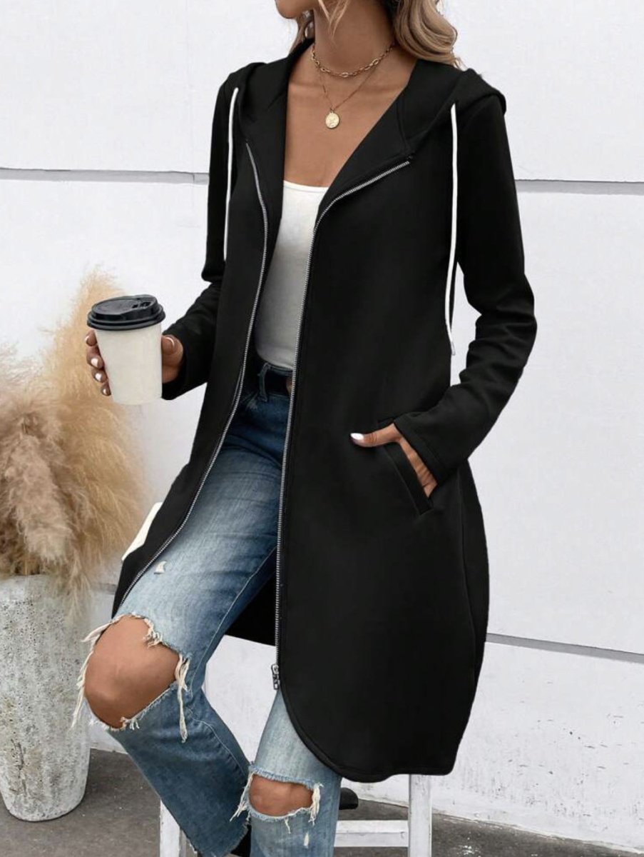 Lifestyle shot of the black zip hooded sweatshirt highlighting its zipper closure and long sleeves.