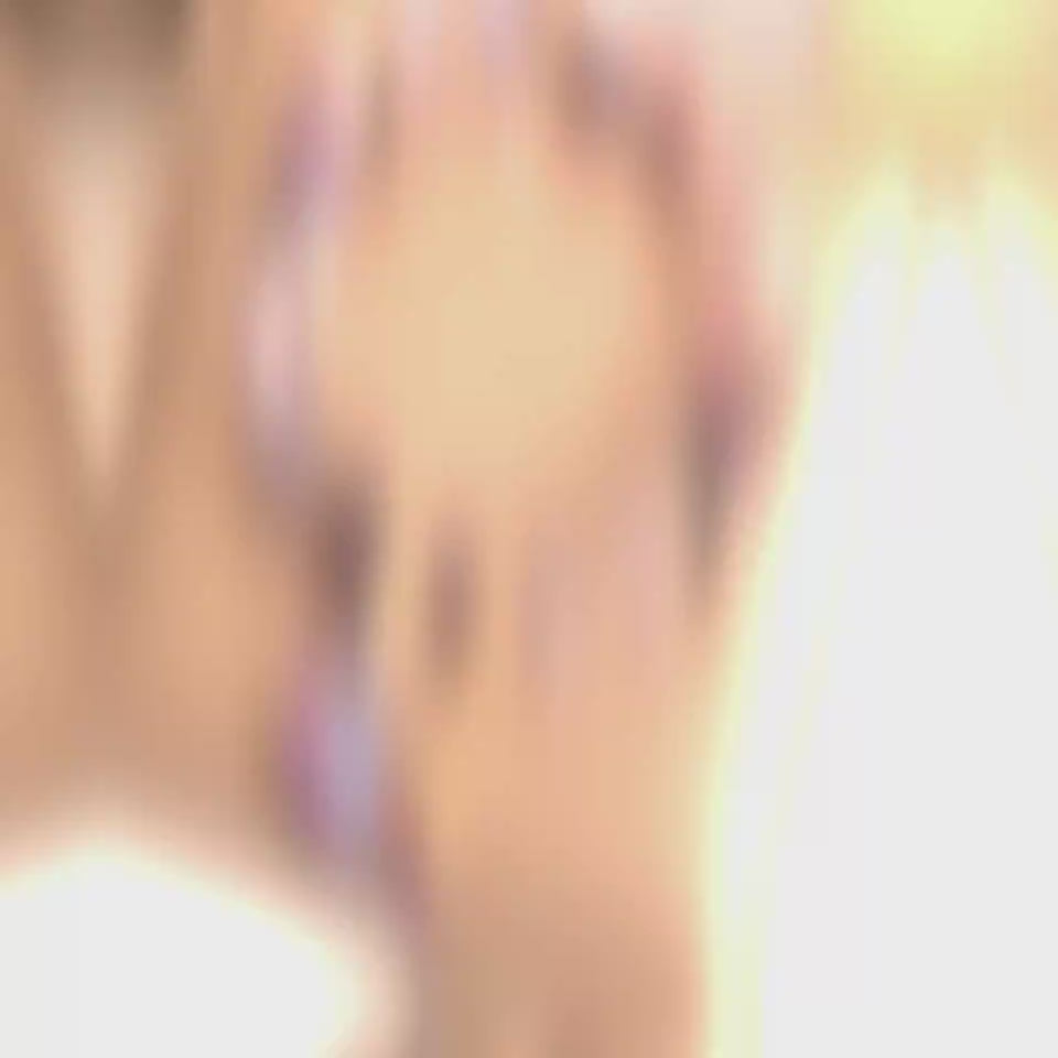 Blurred image with soft lighting featuring the elegant purple natural amethyst heart bracelet.