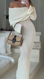 Side view video of white one-shoulder dress featuring off-shoulder design, showcasing elegant silhouette.