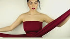 Video showcasing the red stretch fabric dress with a strapless design on a white background.