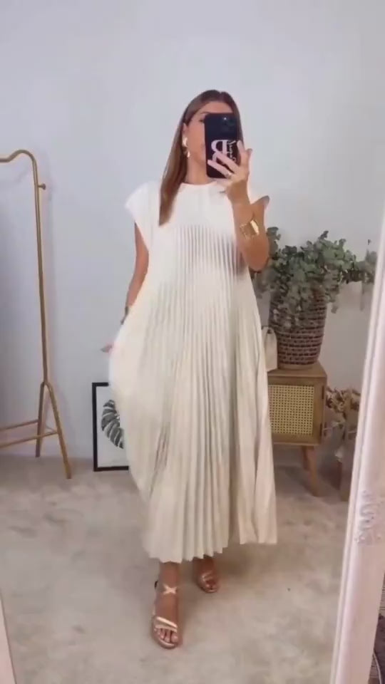 Video showcasing the elegant beige pleated long dress with cap sleeves and flowing design.