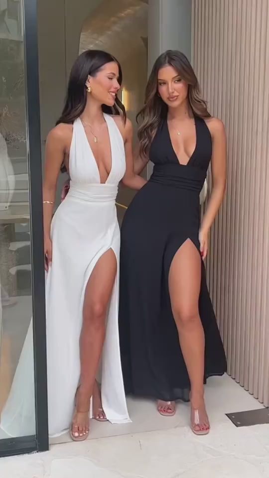 Lifestyle video featuring black and white dresses, showcasing their elegant slit designs.