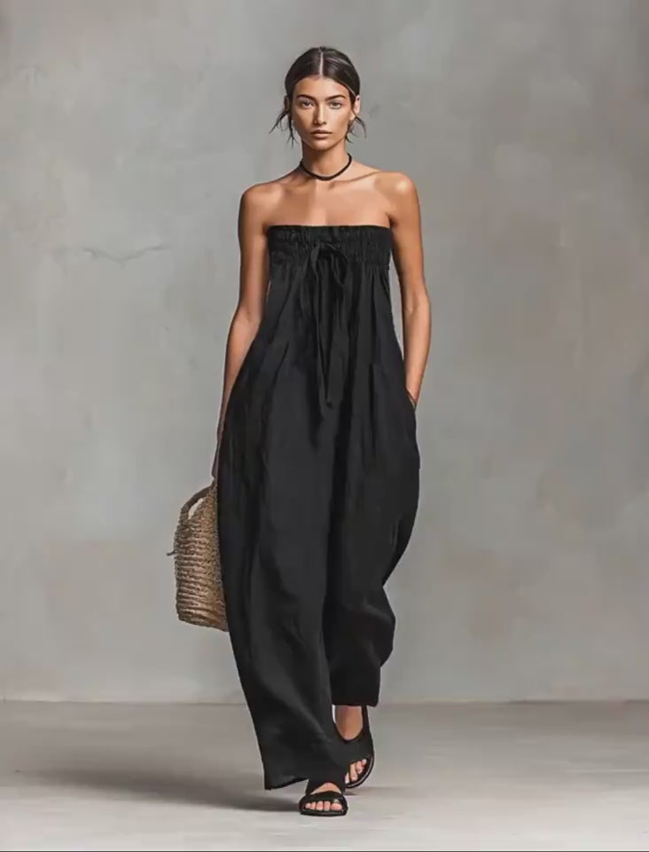 Video showcasing the black strapless jumpsuit with chic ruched details and strapless design.