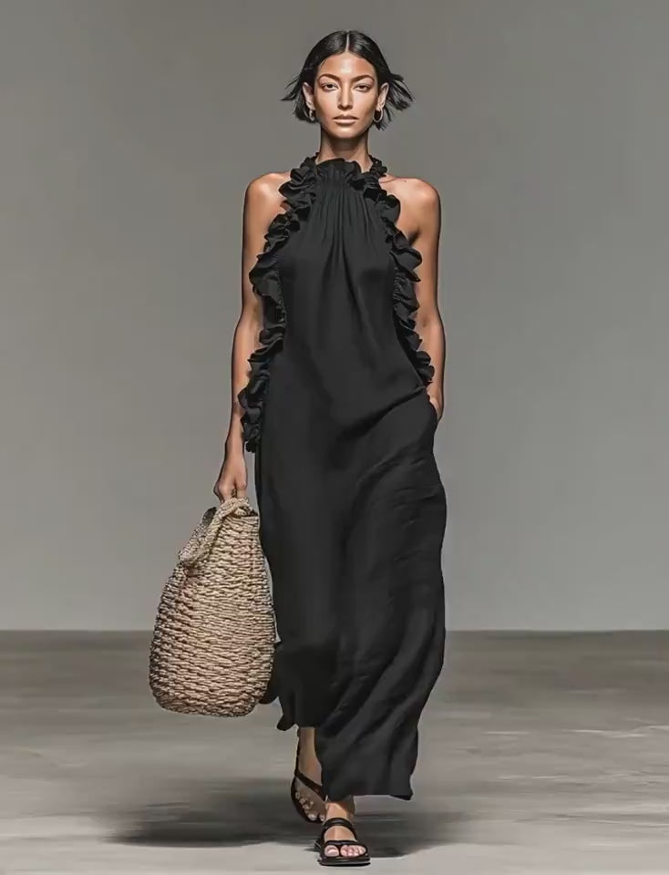 Video showcasing the black maxi dress with ruffled neckline, highlighting its flowy fabric and elegant style.