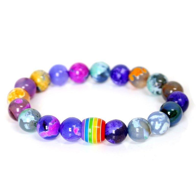 Detail close-up of the colorful rainbow bead bracelet with various natural stones, perfect for a stylish look.