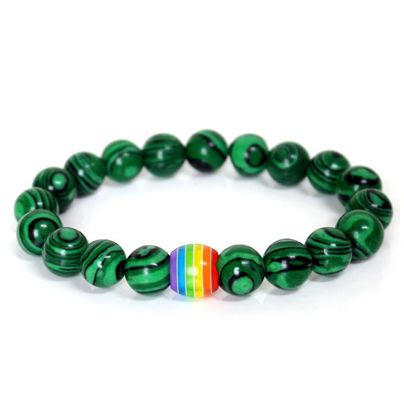 Detail close-up of the green rainbow bead bracelet with elastic band, showcasing vibrant colors.