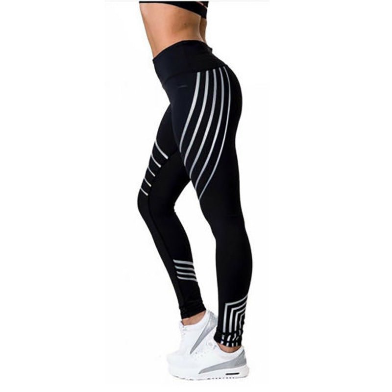 Side view of black and gray reflective sport yoga pants featuring a striped design and high waist.