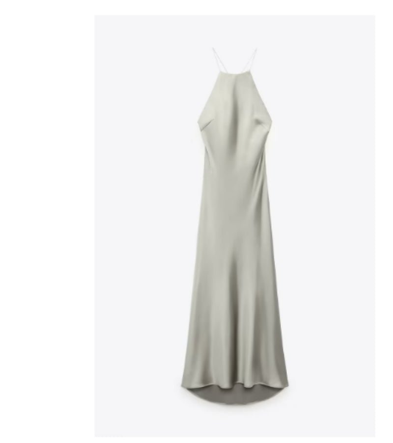 Front view of the light green satin sling dress, showcasing its silk texture and long length in a minimalist style.