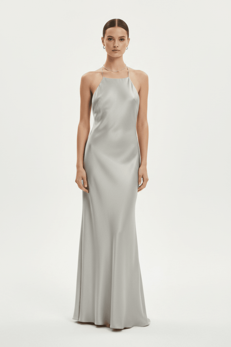Front view of the silver satin sling dress with a halter neck and slim fit, perfect for minimalist fashion.