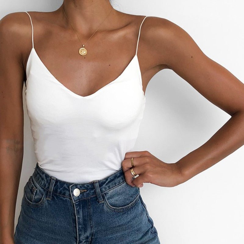 Lifestyle image of a black satin camisole top with thin straps and v-neckline, ideal for chic layering.