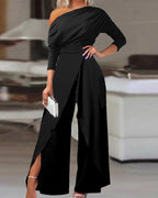 Lifestyle shot of a black long-sleeve jumpsuit, showcasing its sleek design and open-back detail.