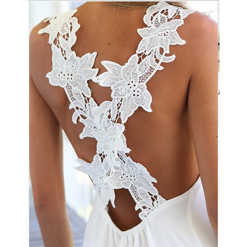 Detail close-up of the back of a white cover-up featuring floral lace and v-neck design.