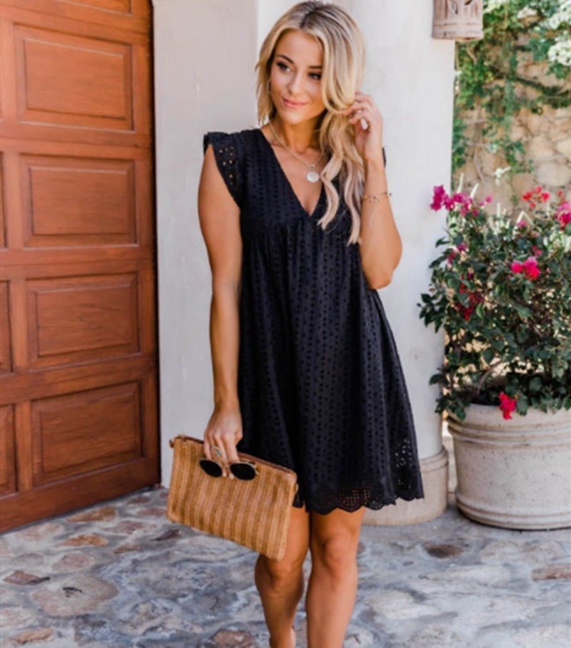 Lifestyle shot of a black sleeveless lace dress featuring a V-neck and flowy fit, ideal for chic occasions.