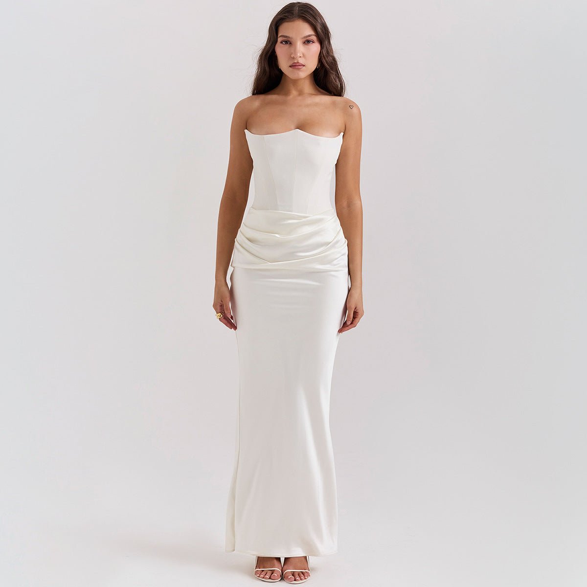 Front view of the white evening gown with a fitted silhouette, elegant minimalist design for special occasions.