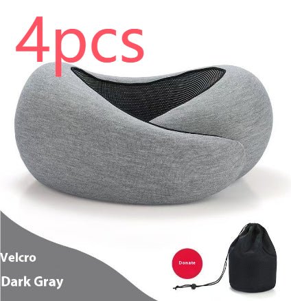 Detail close-up of the dark gray travel neck pillow showing adjustable strap and memory foam.