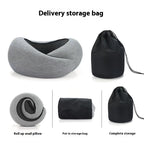 Dark gray neck pillow showcasing its adjustable memory foam design in a lifestyle shot.
