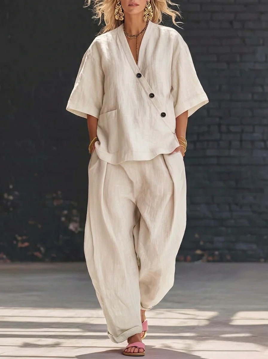 Lifestyle shot of loose fit beige two-piece set with v-neck top and high waist trousers, stylish summer outfit.