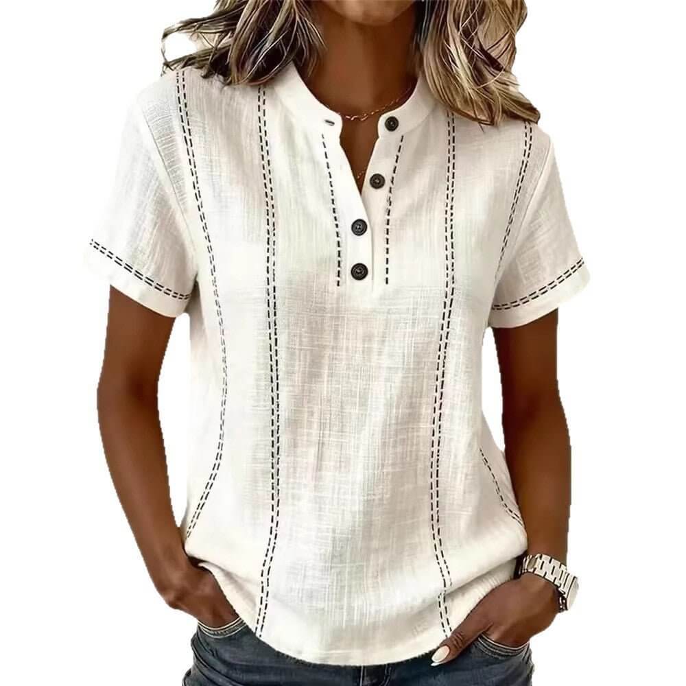 Front view of the white short sleeve blouse featuring a v-neck and rolled sleeves, chic minimalist style.