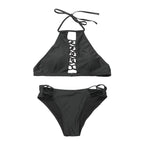Detail of black bikini bottom with high-cut and lace detail, highlighting its elegant design.