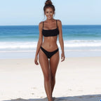 Front view of the black tube top bikini swimsuit, emphasizing its chic two-piece and minimalist style.