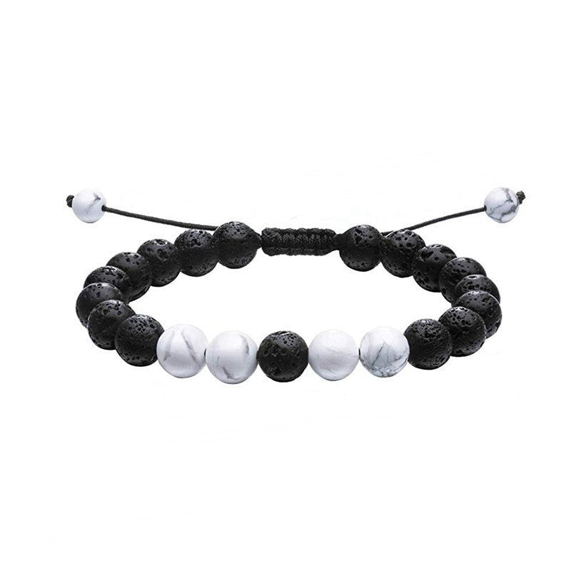 Close-up of black and white bracelet featuring beaded design, elegant minimalist style.