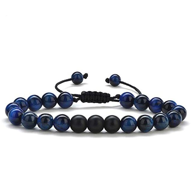 Detail close-up of black and blue beaded bracelet, showcasing stylish couple accessory design.