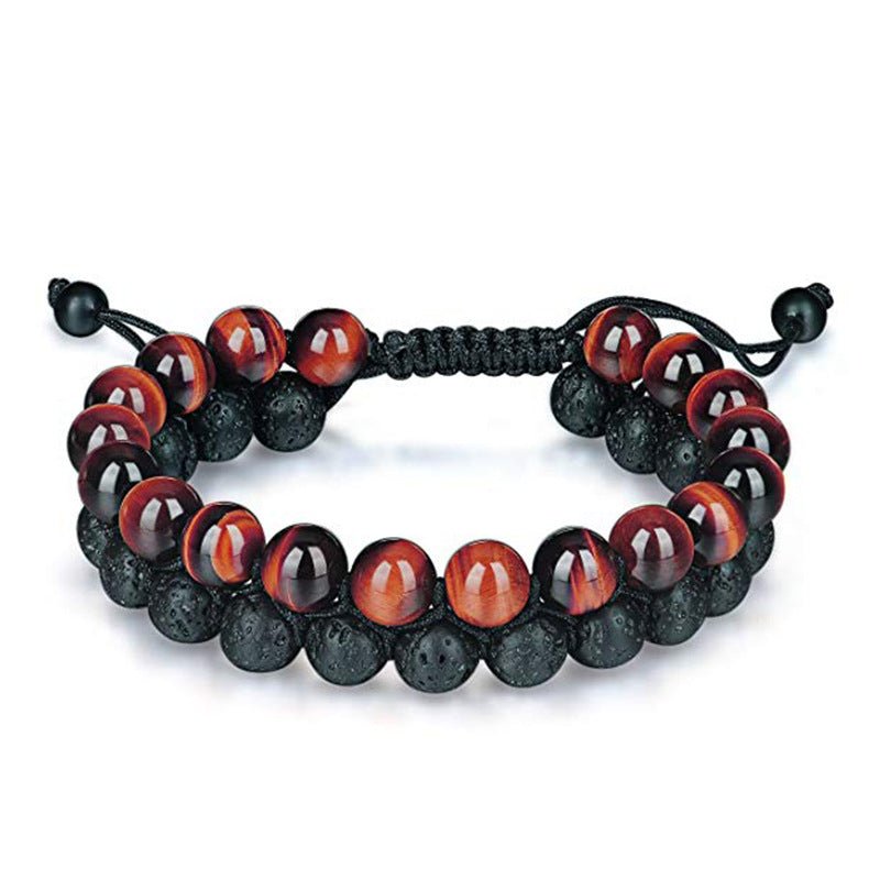 Detail close-up of black and blue beaded bracelet with matte finish, stylish couple accessory.