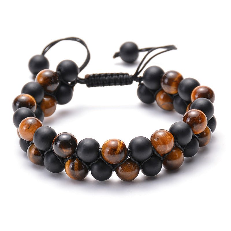 Detail close-up of black and brown beaded bracelet with matte finish, elegant couple accessory.