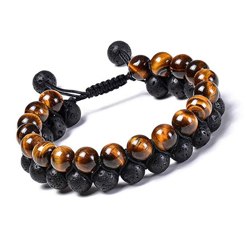 Detail close-up of black and brown couple bracelets with beaded design, elegant accessory.