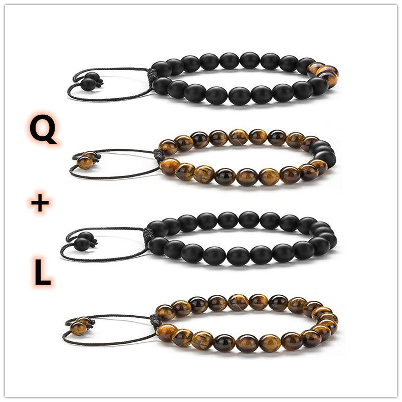 Detail of couple bracelets with matte finish and elastic band, stylish and adjustable design.