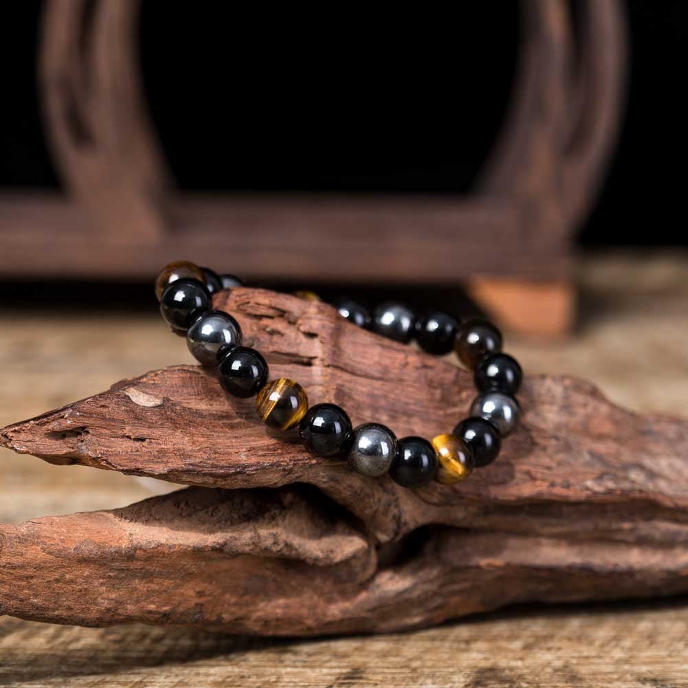 Detail close-up of the tiger eye stone bracelet highlighting its beaded design.