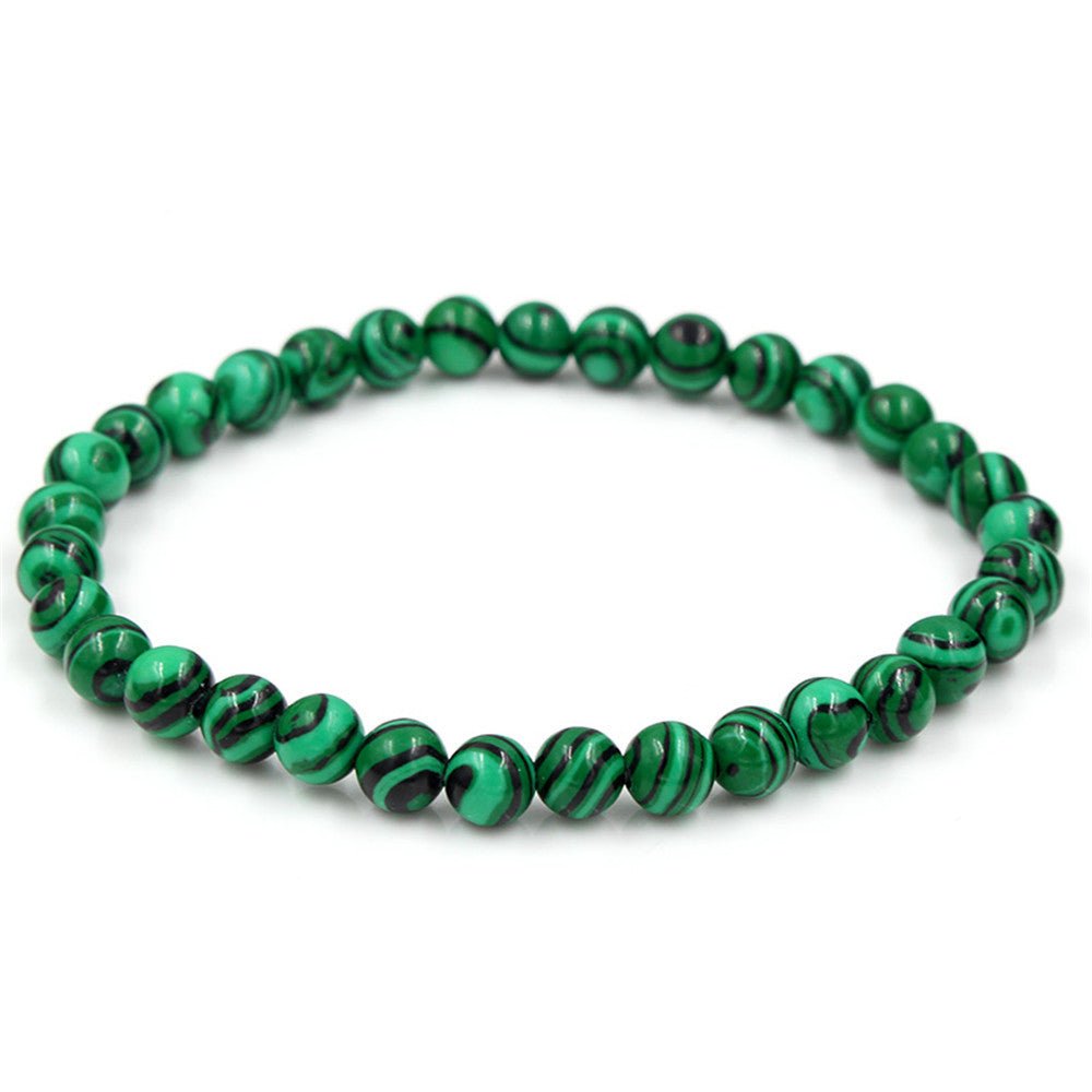 Tiger Eye Stone Bracelet featuring faceted green beads on a white background