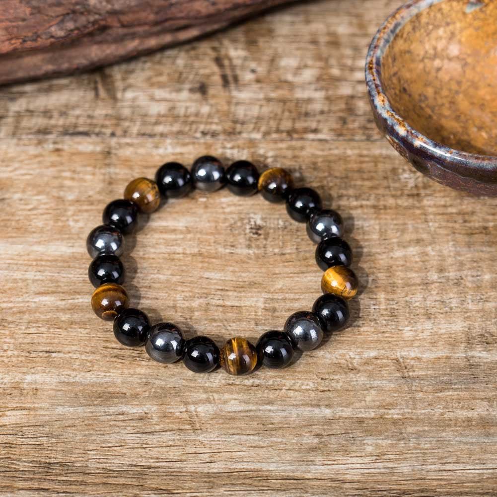 Lifestyle shot of the tiger eye stone bracelet on a natural background.