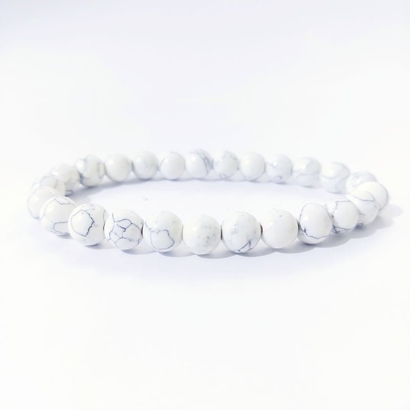 Tiger Eye Stone Bracelet with a white beaded design on a white background