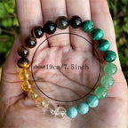 Detail close-up of the citrine malachite bracelet on a solid background, showcasing green and yellow colors.