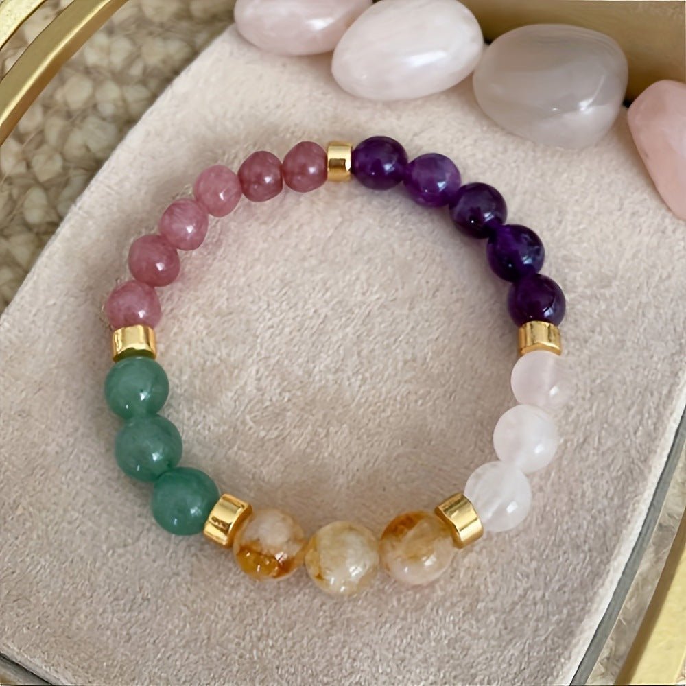Close-up detail of the citrine malachite bracelet with gold accents and a beaded design.