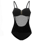 Detail of the orange swimsuit featuring a mesh panel and adjustable straps on a white background.