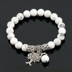 Detail close-up of the vintage white turquoise bead bracelet with tree charm, showcasing frosted beads.
