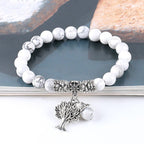Detail close-up of the vintage white turquoise bead bracelet featuring silver charm and frosted beads.