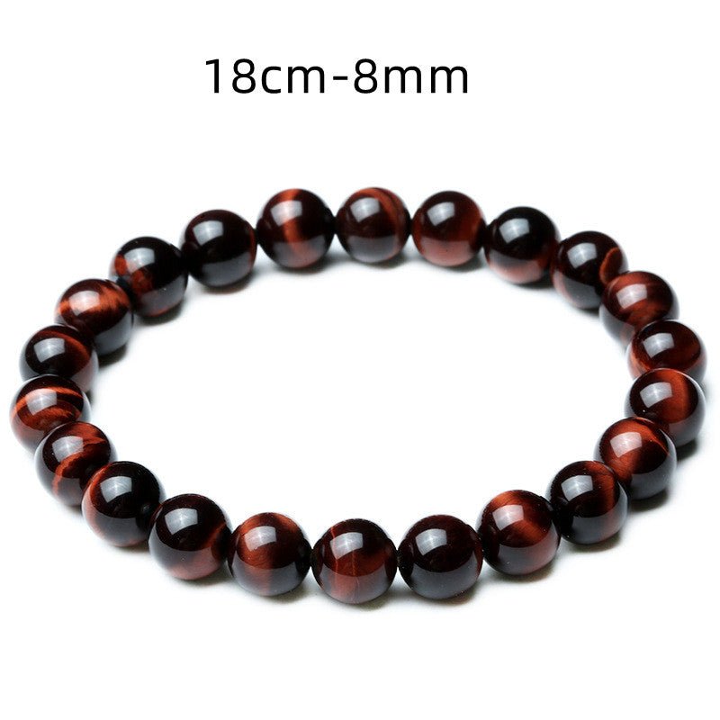 Detail close-up of vintage red tiger eye bracelet showcasing stretch design and bead details on a white background.