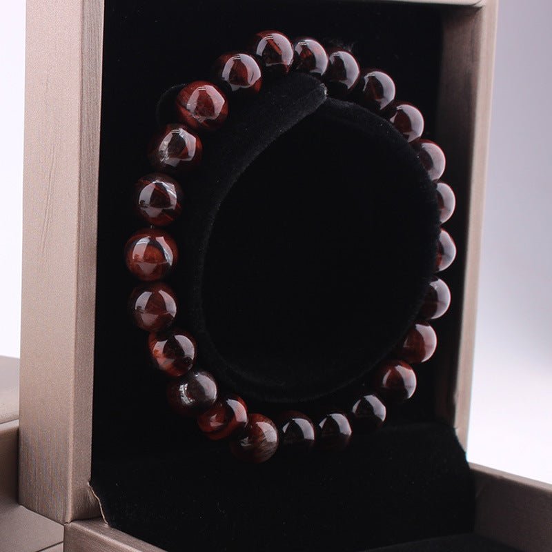 Vintage red tiger eye bracelet in packaging with display box, featuring round red and black 8mm beads.
