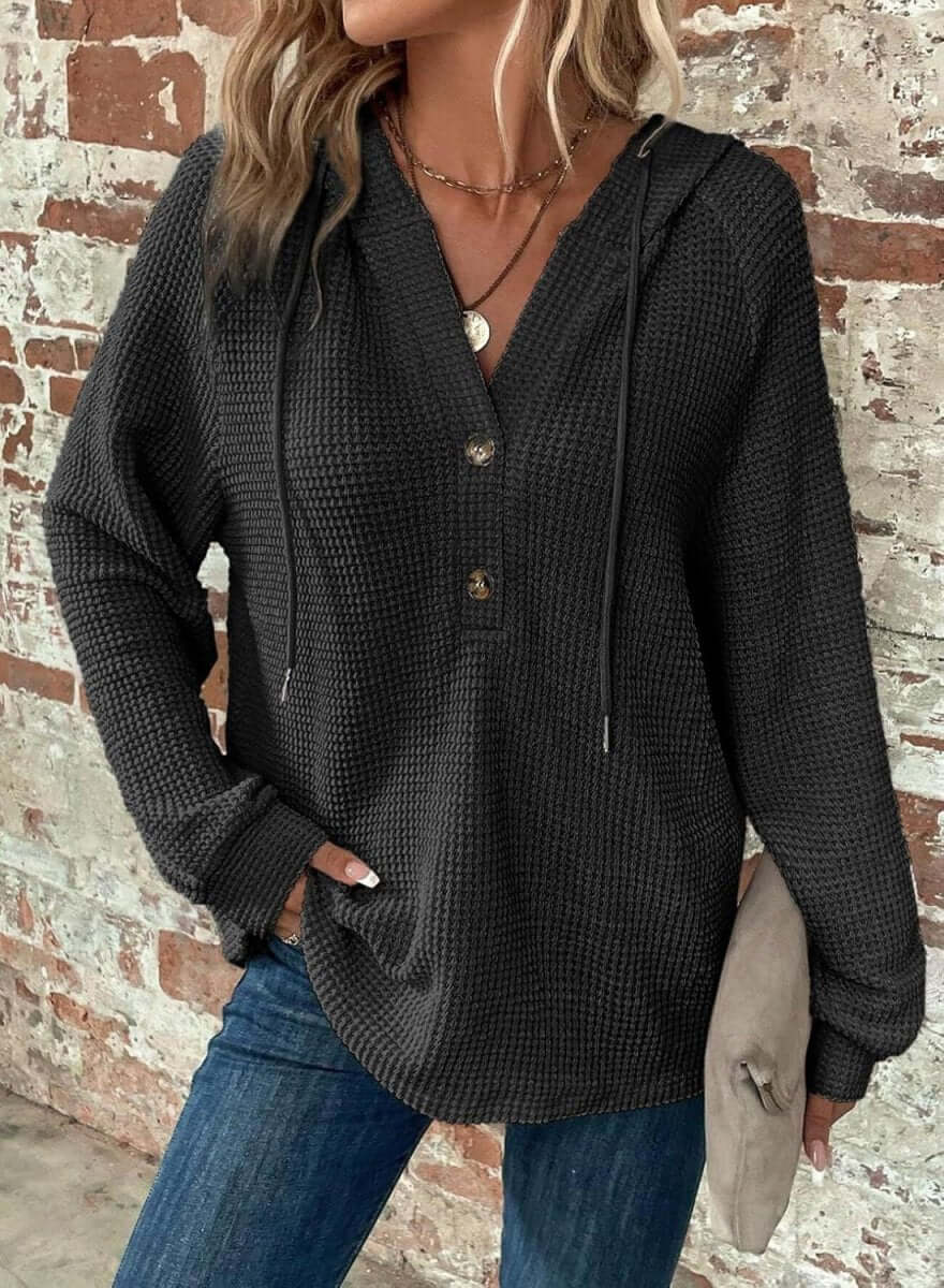 White waffle hooded pullover sweater with hood and button detail, elegant lifestyle shot.