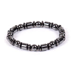 Detail view of black and silver beaded Magnetic Therapy Bracelet on white background, showcasing its unique design.