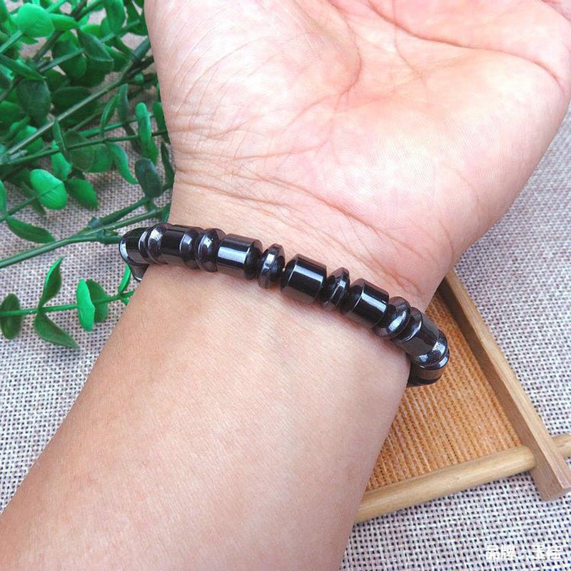 Close-up of black and silver Magnetic Therapy Bracelet, highlighting its beaded design and magnetic elements.