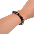 Black Magnetic Therapy Bracelet worn on wrist, emphasizing its chic and fashionable appeal.