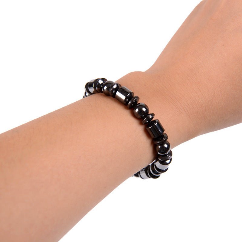 Black Magnetic Therapy Bracelet worn on wrist, emphasizing its chic and fashionable appeal.