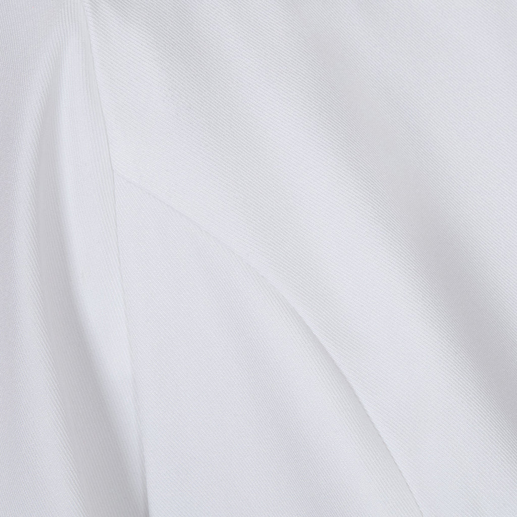 Close-up of the fabric texture of the white lapel blazer, illustrating its smooth and structured material.