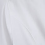 Close-up of the fabric texture of the white lapel blazer, illustrating its smooth and structured material.