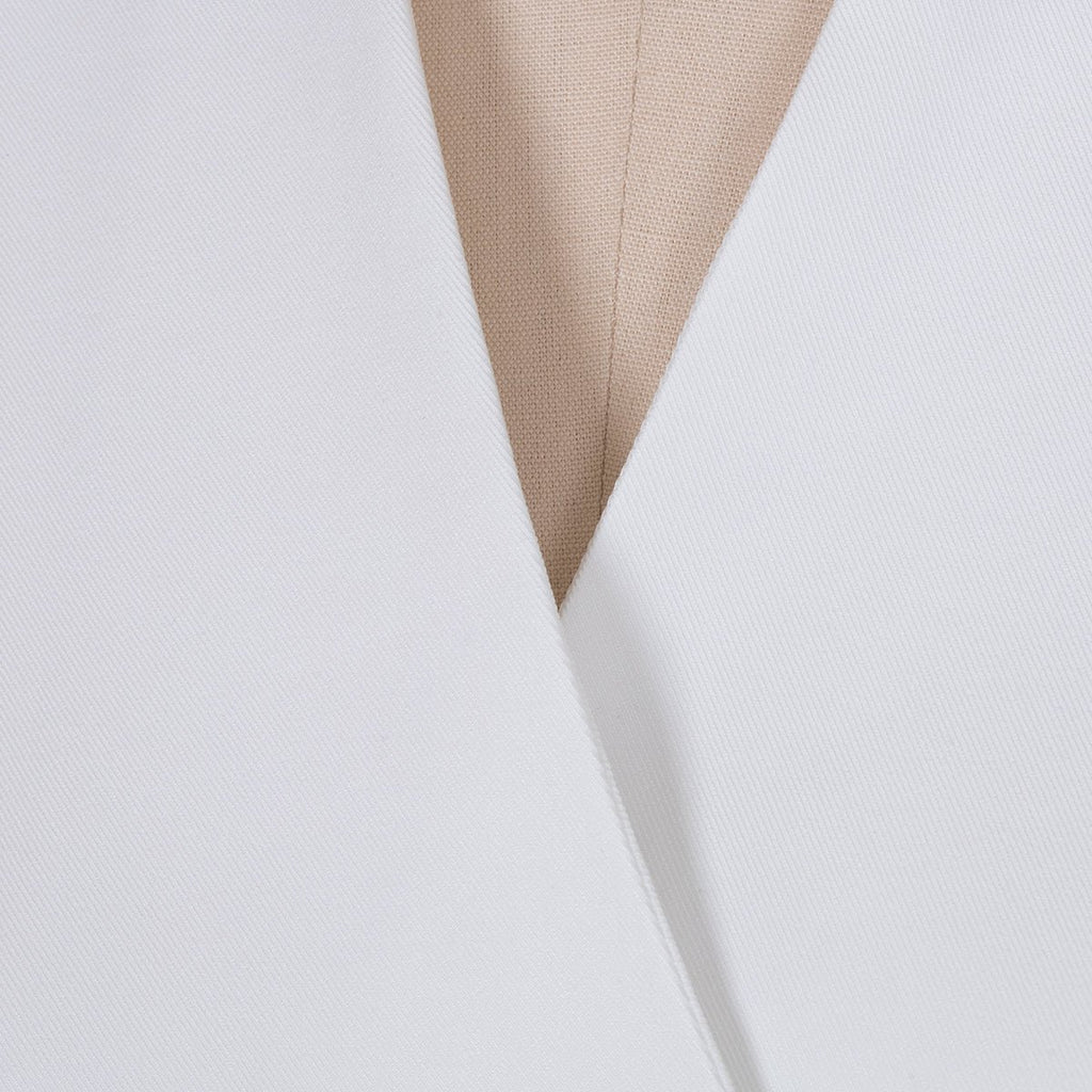 Close-up detail of the white lapel blazer's v-neck and lapel design, showcasing its chic features.